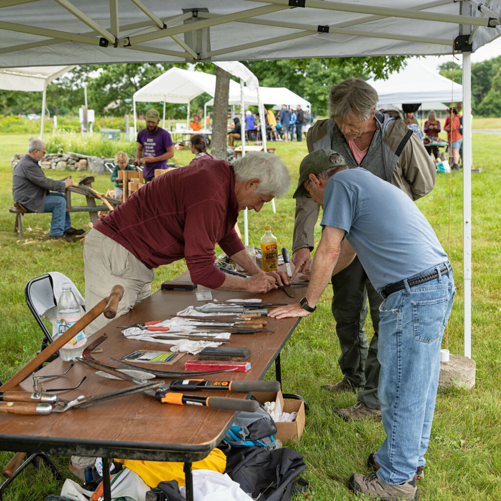 Participants at Farm & Homestead Day learn to sharpen tools